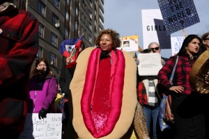 A woman marches in a costume during the Women's March in Manhattan in New York