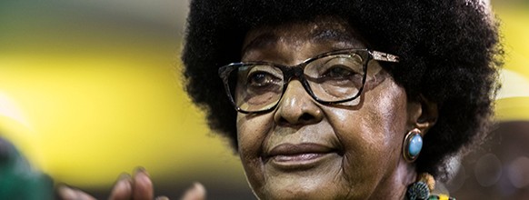 (FILES) In this file photo taken on December 20, 2017 Winnie Mandela, former wife of former president Nelson Mandela, attends the last day of the NASREC Expo Centre in Johannesburg during the African National Congress (ANC) 54th National Conference. Former wife of Nelson Mandela Winnie Mandela has died, according to South African media on April 2, 2018. / AFP / GULSHAN KHAN 

 FILES-SAFRICA-POLITICS-RAMPHOSA